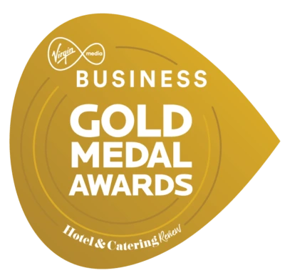Gold medal award for excellence in hotel and catering services displayed on a gold ribbon background.