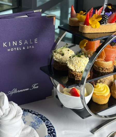 Elegant afternoon tea with gourmet pastries and scones at a Kinsale hotel, featuring luxurious dining and ambience.